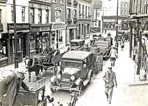 Biggin Street looking north 1930s, the man walking towards the camara is approximately outside what was no 6 where the Dover's first public library opened in 1935. Hollingsbee Collection Dover Museum